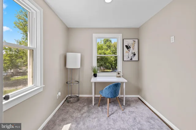 a view of room with window and wooden floor
