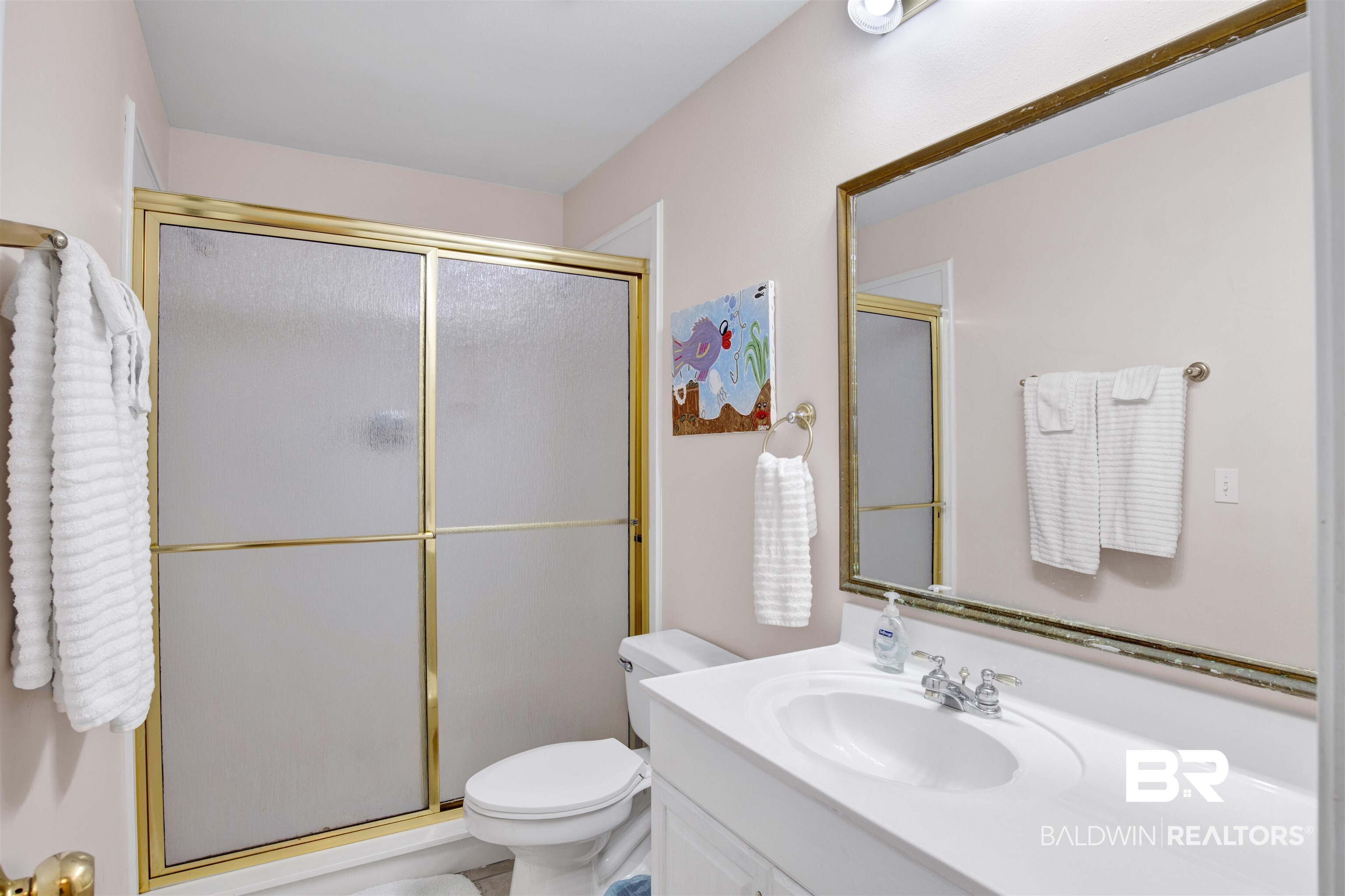 33093 River Road Orange Beach, AL 36561 - Photo 23 of 30 Bathroom featuring a shower with door, toilet, and vanity