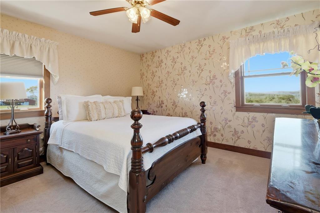 127 East Buffalo Church Road Washington, PA 15301 - Photo 16 of 33 a bedroom with a bed and a chandelier