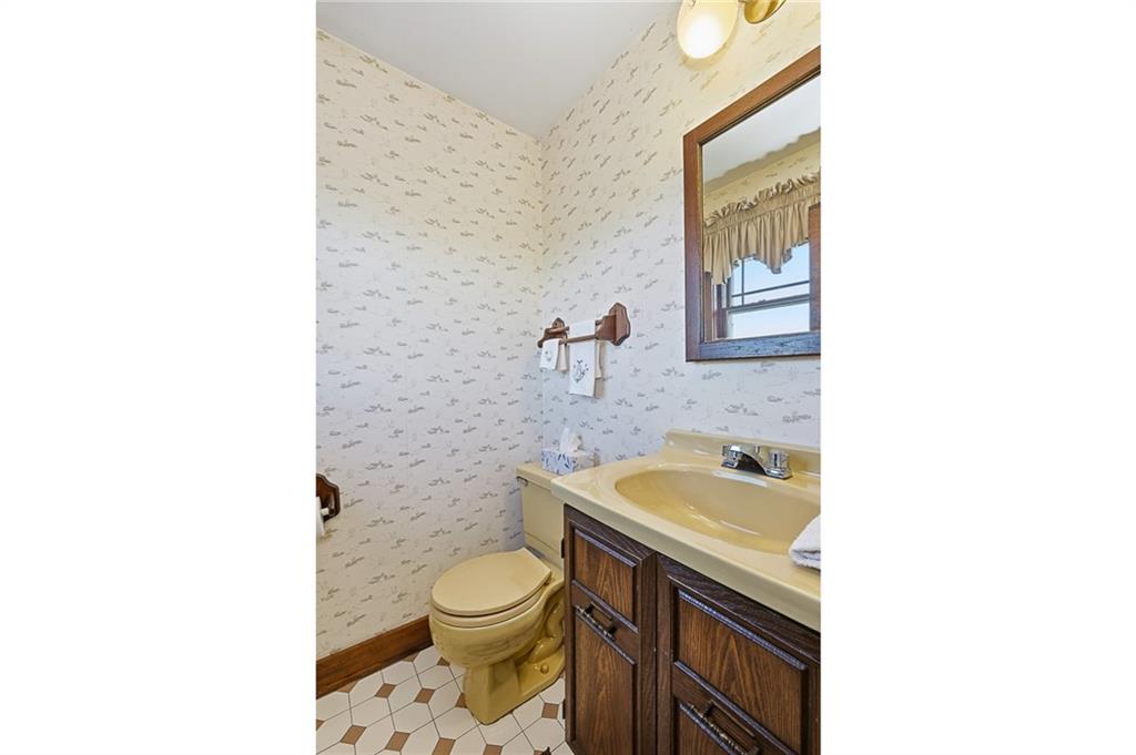 127 East Buffalo Church Road Washington, PA 15301 - Photo 18 of 33 a bathroom with a granite countertop toilet sink and mirror