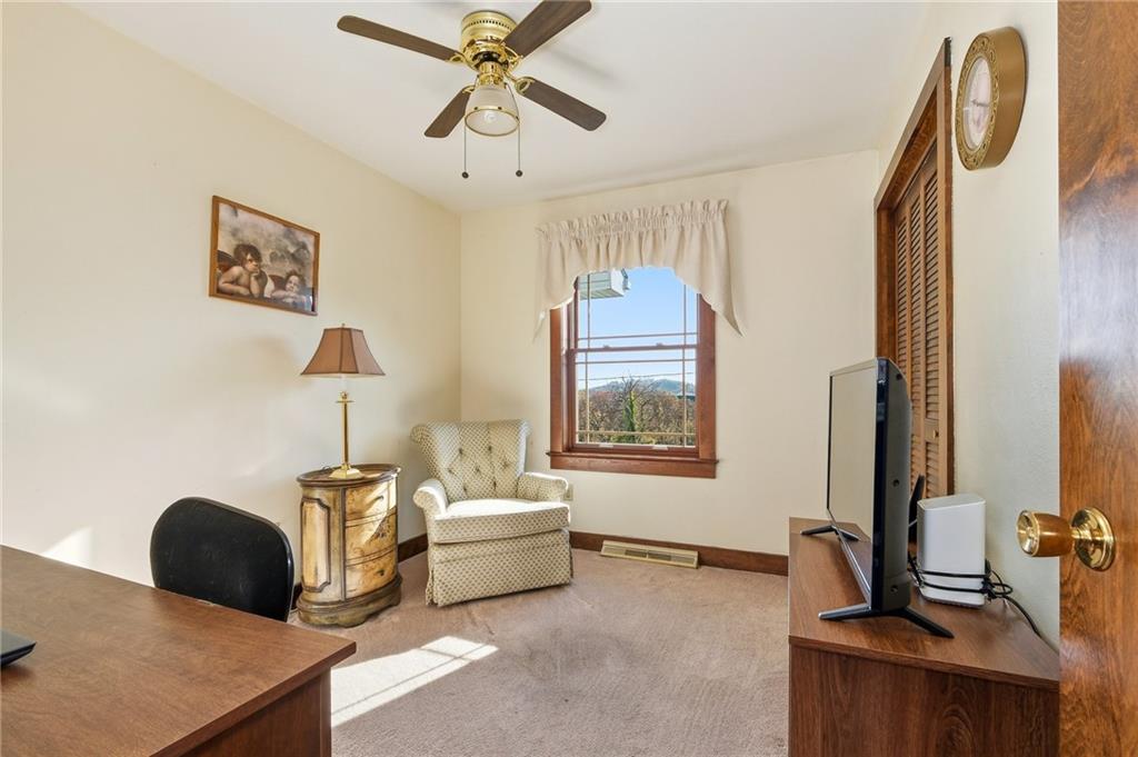 127 East Buffalo Church Road Washington, PA 15301 - Photo 21 of 33 a living room with furniture a window and a flat screen tv