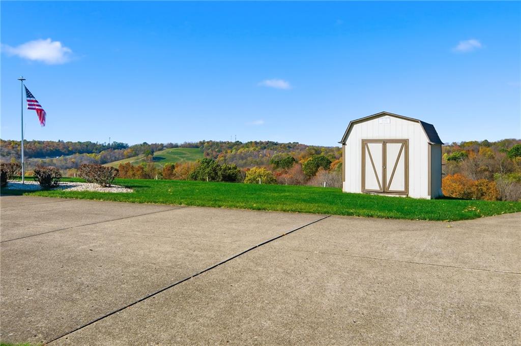 127 East Buffalo Church Road Washington, PA 15301 - Photo 27 of 33 a front view of a house with a yard and garage