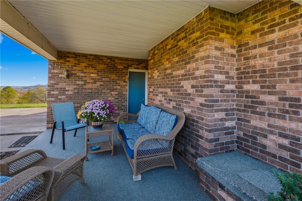 127 East Buffalo Church Road Washington, PA 15301 - Photo 4 of 33 a outdoor living space with furniture and flowers