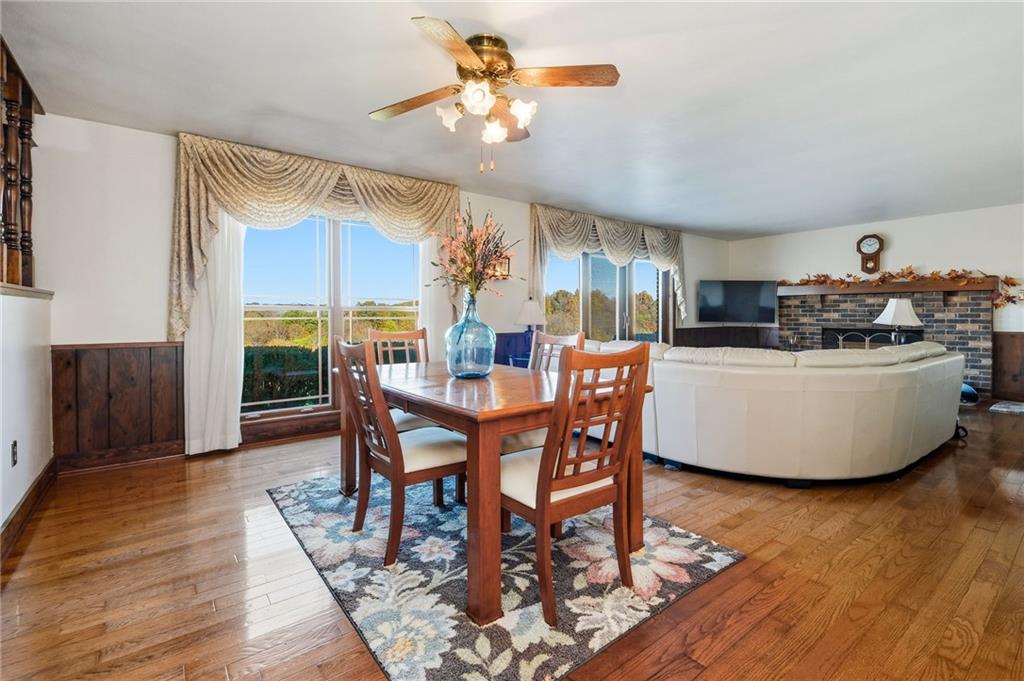 127 East Buffalo Church Road Washington, PA 15301 - Photo 9 of 33 a dining room with furniture a chandelier and wooden floor