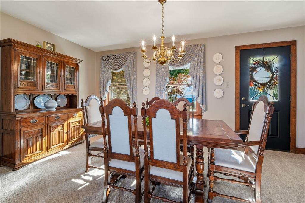 127 East Buffalo Church Road Washington, PA 15301 - Photo 10 of 33 a view of a dining room with furniture a chandelier and window