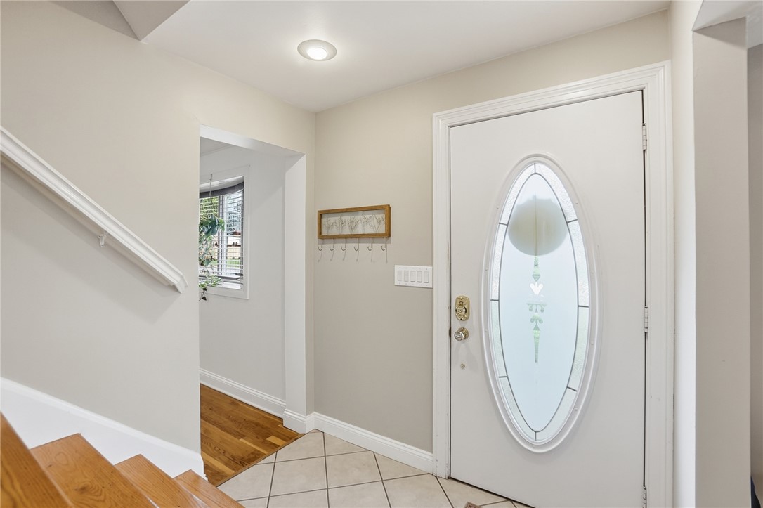 150 Littlejohn Road Troy, OH 45373 - Photo 6 of 40 This inviting entryway features natural light and durable flooring, perfect for welcoming guests.