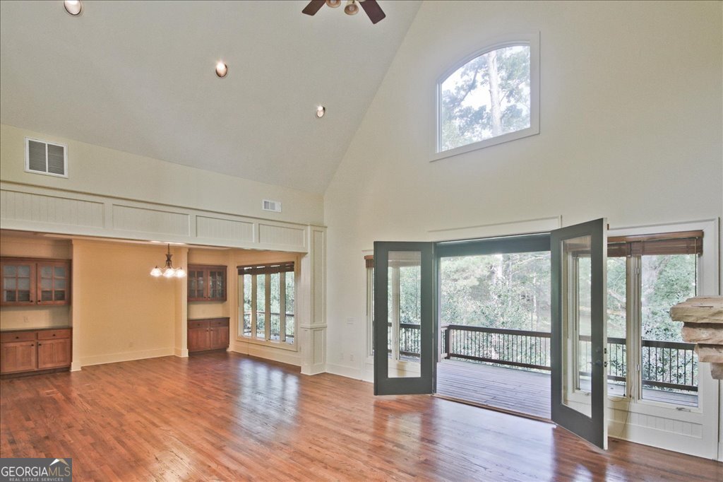 194 Edgewater Trail South Toccoa, GA 30577 - Photo 11 of 70 a view of an empty room with wooden floor and a window