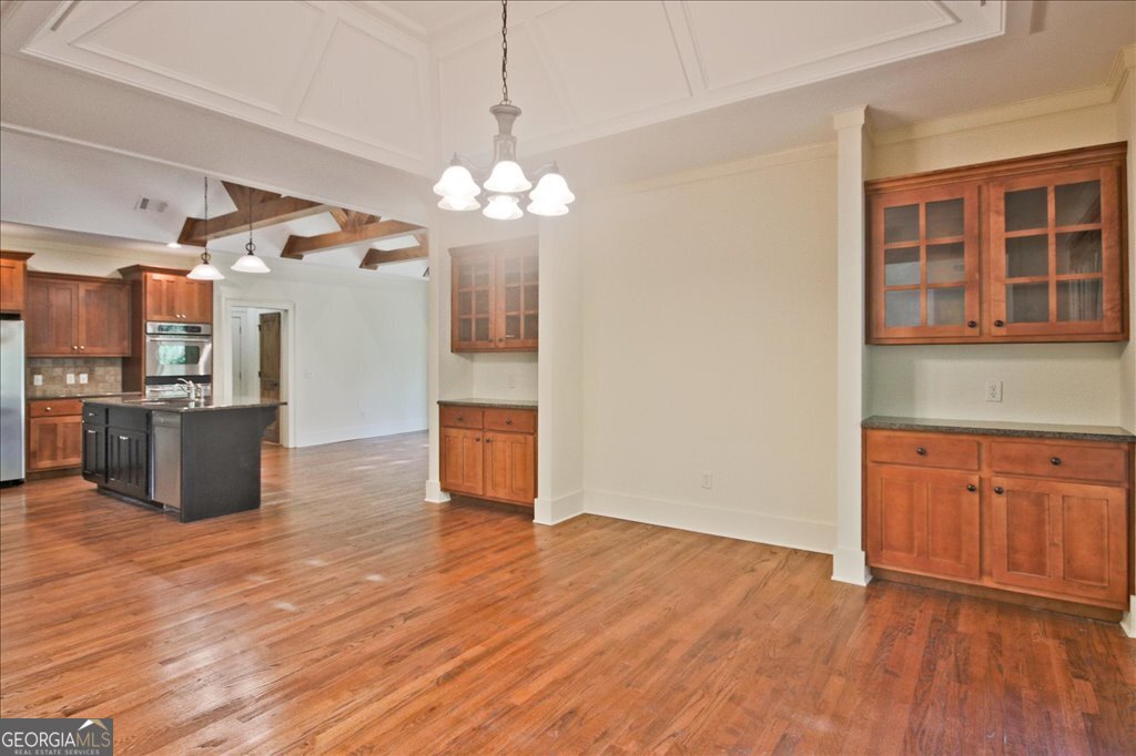 194 Edgewater Trail South Toccoa, GA 30577 - Photo 14 of 70 a view of a kitchen with stainless steel appliances wooden floor and cabinets