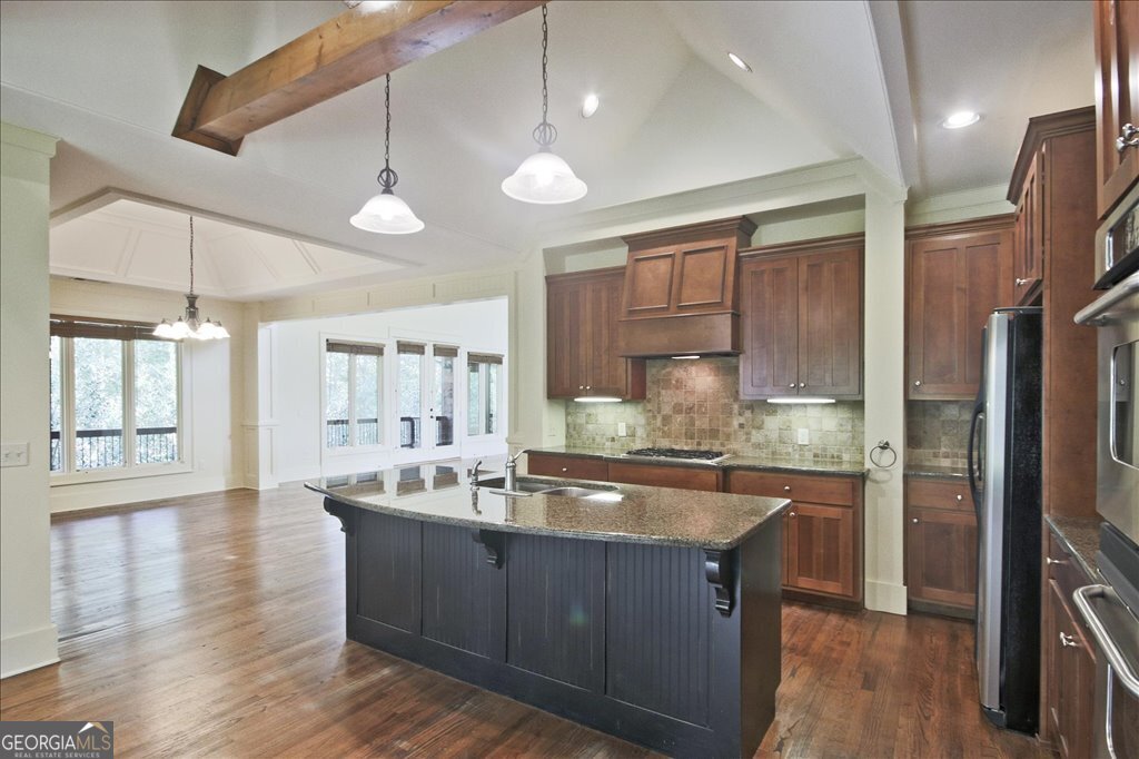 194 Edgewater Trail South Toccoa, GA 30577 - Photo 17 of 70 a kitchen with stainless steel appliances granite countertop a sink a stove and refrigerator