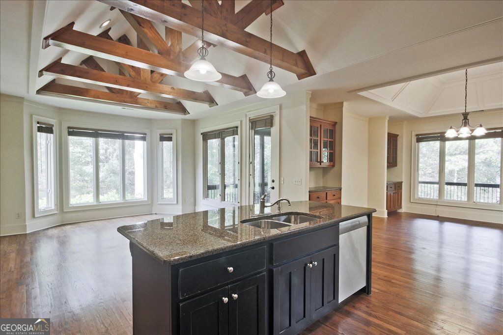 194 Edgewater Trail South Toccoa, GA 30577 - Photo 18 of 70 a kitchen with granite countertop a sink and a wooden floor