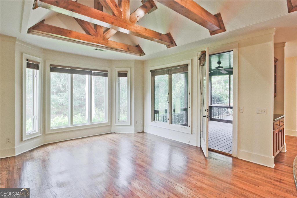 194 Edgewater Trail South Toccoa, GA 30577 - Photo 20 of 70 a view of an empty room with wooden floor and a window