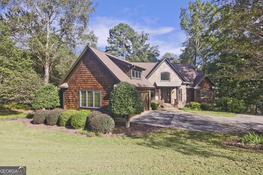 194 Edgewater Trail South Toccoa, GA 30577 - Photo 2 of 70 a front view of house with yard and trees around