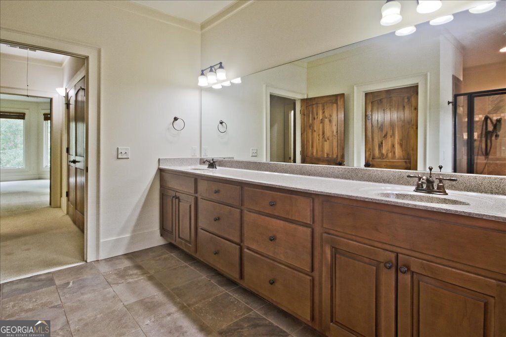194 Edgewater Trail South Toccoa, GA 30577 - Photo 28 of 70 a spacious bathroom with a double vanity sink and a mirror