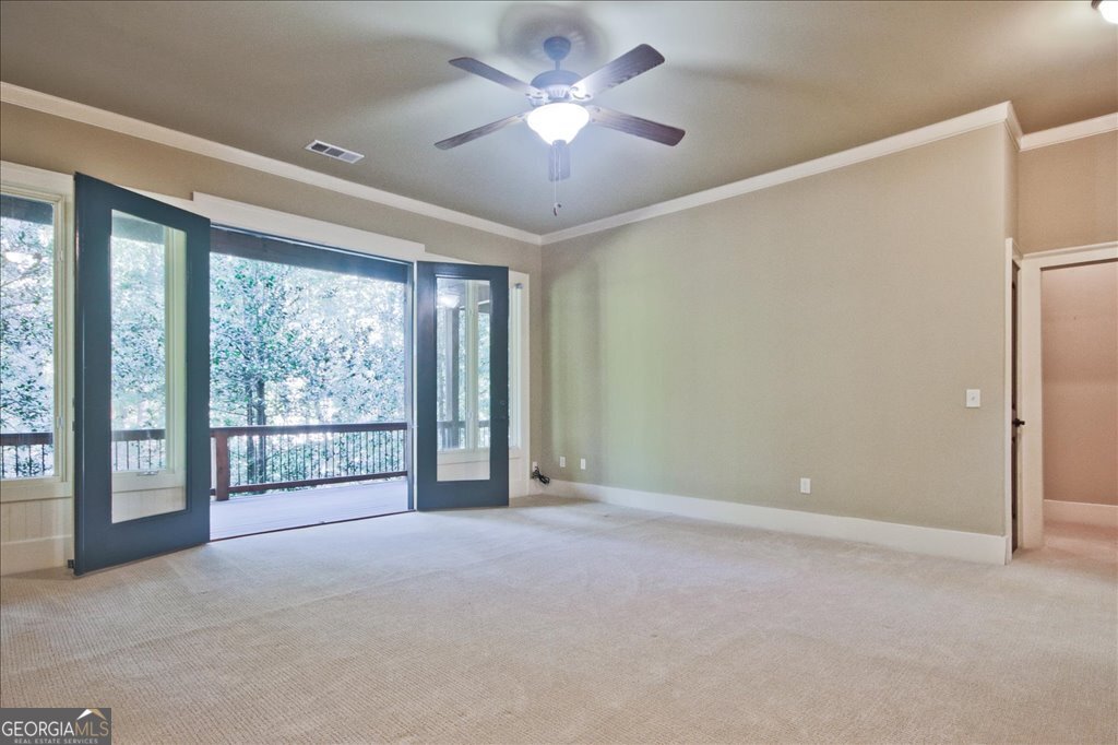 194 Edgewater Trail South Toccoa, GA 30577 - Photo 35 of 70 a view of a livingroom with a ceiling fan and window
