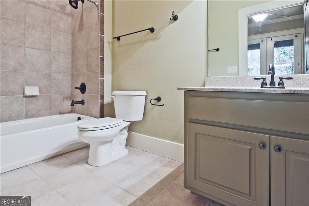 194 Edgewater Trail South Toccoa, GA 30577 - Photo 39 of 70 a bathroom with a sink toilet and shower