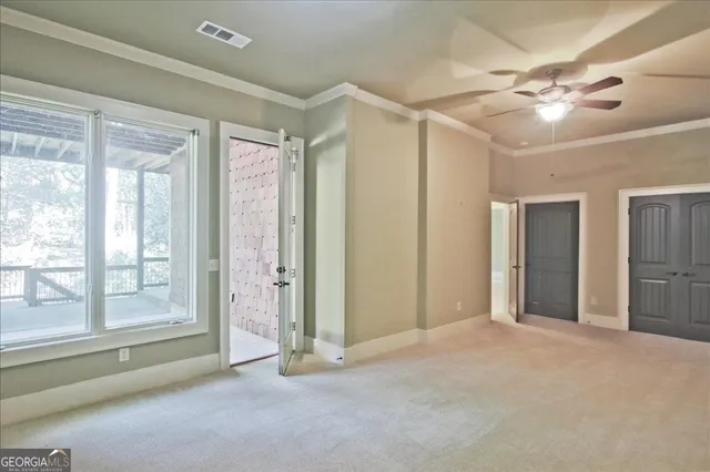 a view of a house with a yard and a tree