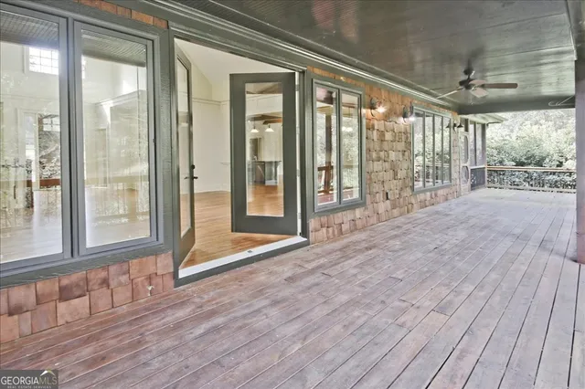 a view of a swimming pool with an outdoor seating and a garden