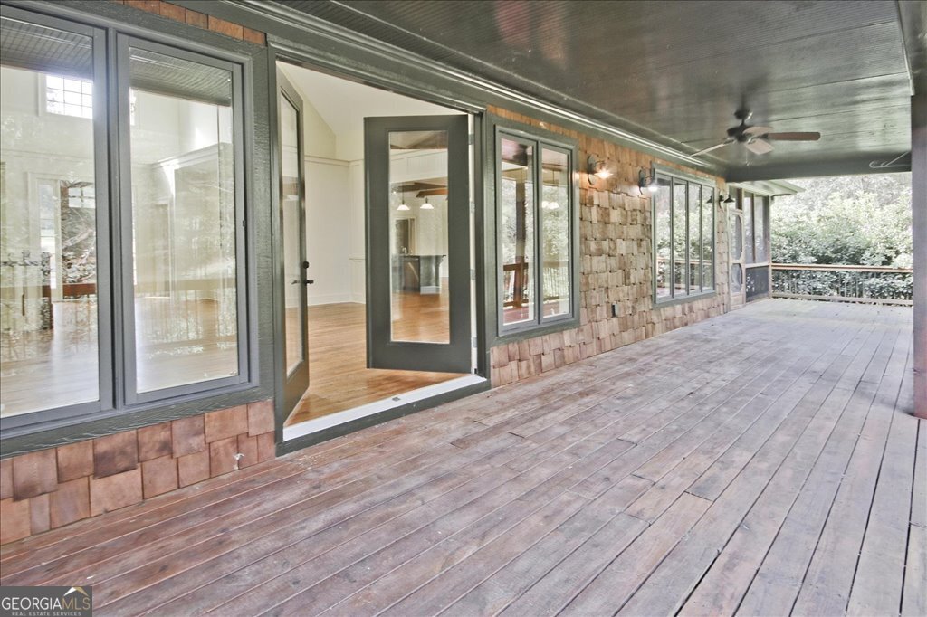 194 Edgewater Trail South Toccoa, GA 30577 - Photo 49 of 70 a view of an empty room with wooden floor and a window