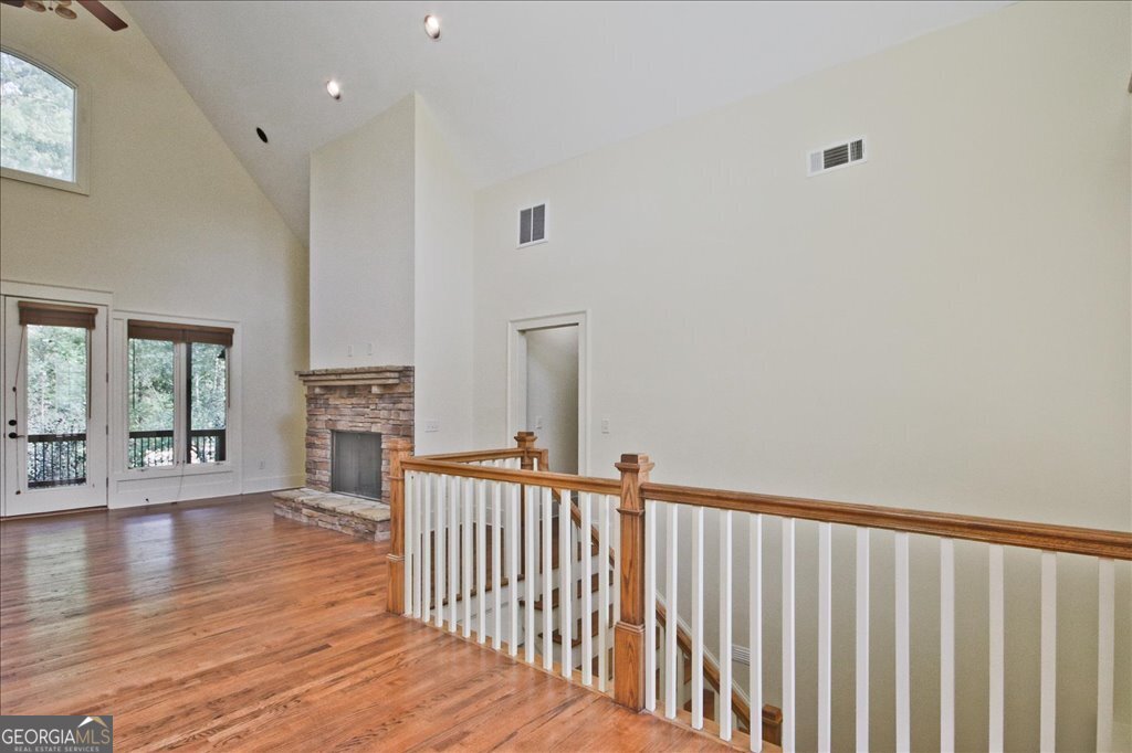 194 Edgewater Trail South Toccoa, GA 30577 - Photo 8 of 70 a view of a livingroom with wooden floor and stairs