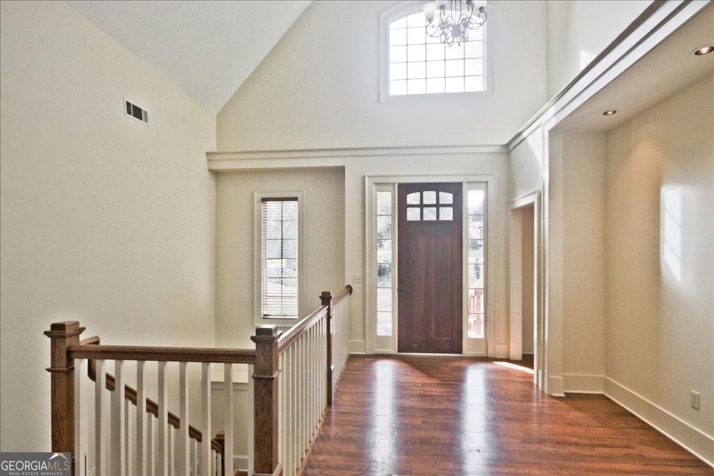 194 Edgewater Trail South Toccoa, GA 30577 - Photo 9 of 70 a view of a hallway with wooden floor and stairs