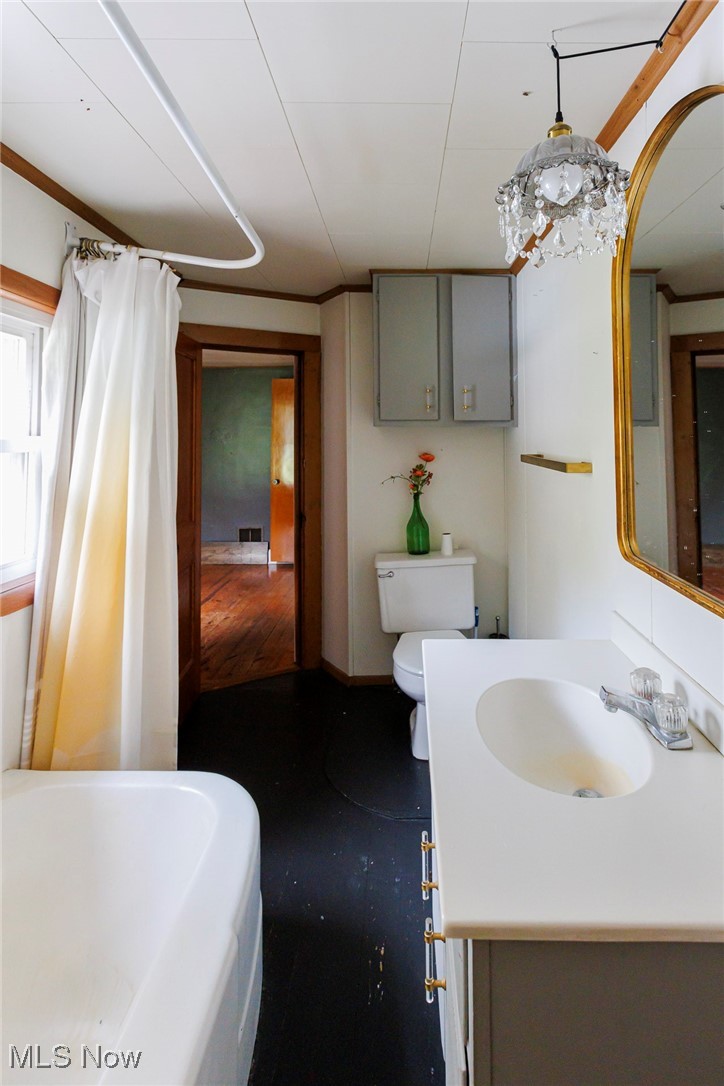 7997 Chestnut Ridge Road Northwest Beach City, OH 44608 - Photo 13 of 31 Full bathroom with vanity, toilet, and curtained shower