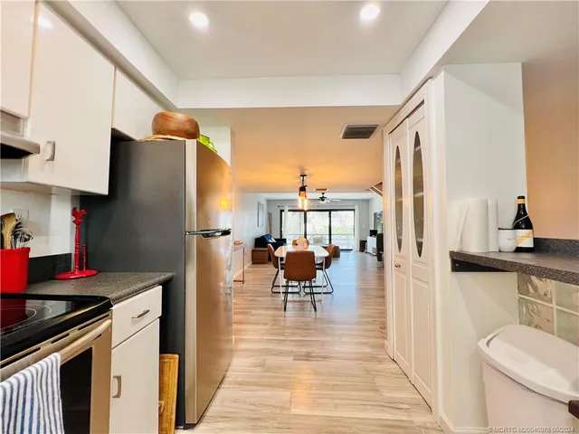 a view of a living room and hardwood floor