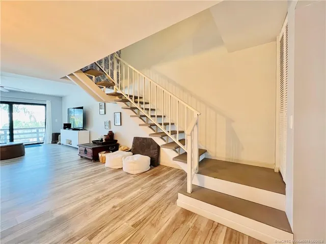 a bedroom with a large bed and a large window
