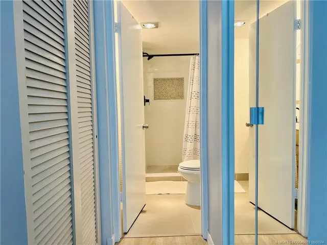 a bedroom with a bed and closet