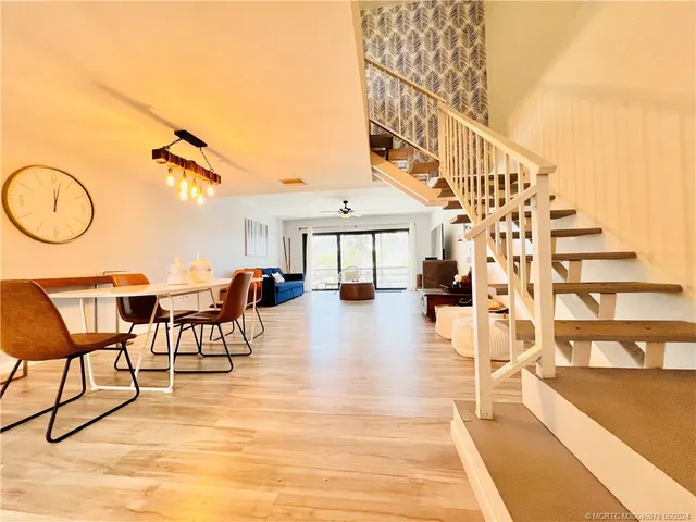 a view of a kitchen with a table and chairs