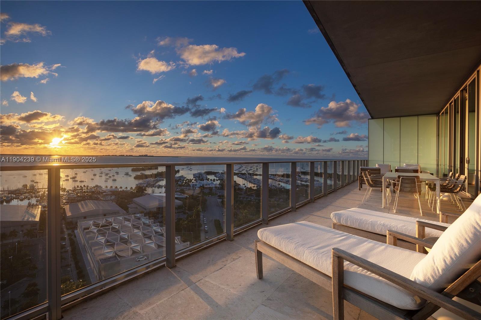 a balcony with furniture and wooden floor
