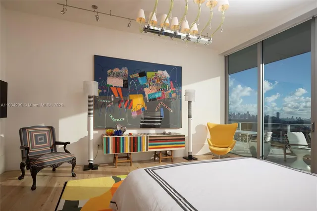 a living room with furniture workspace and a flat screen tv