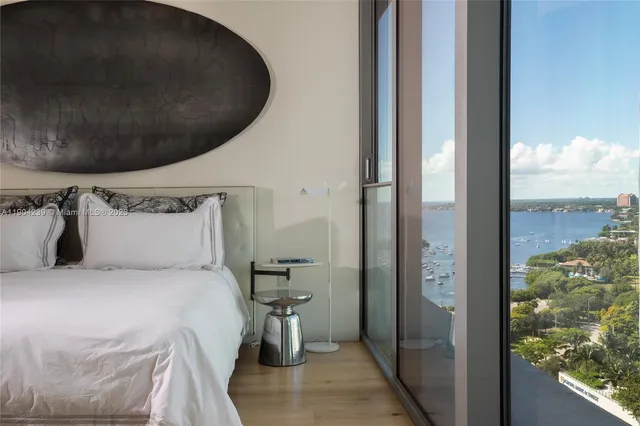 a view of a lake with a house in the background