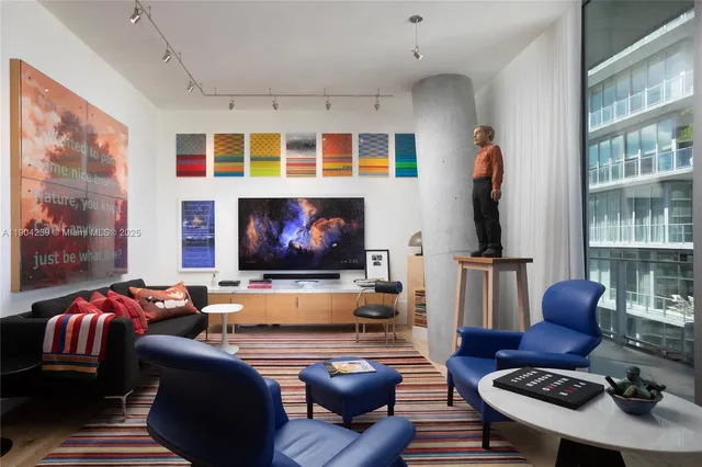 a view of a porch with chairs and backyard