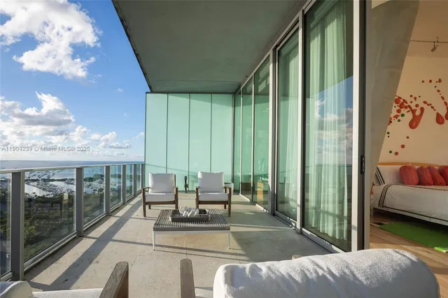 a open kitchen with stainless steel appliances kitchen island granite countertop a sink and cabinets