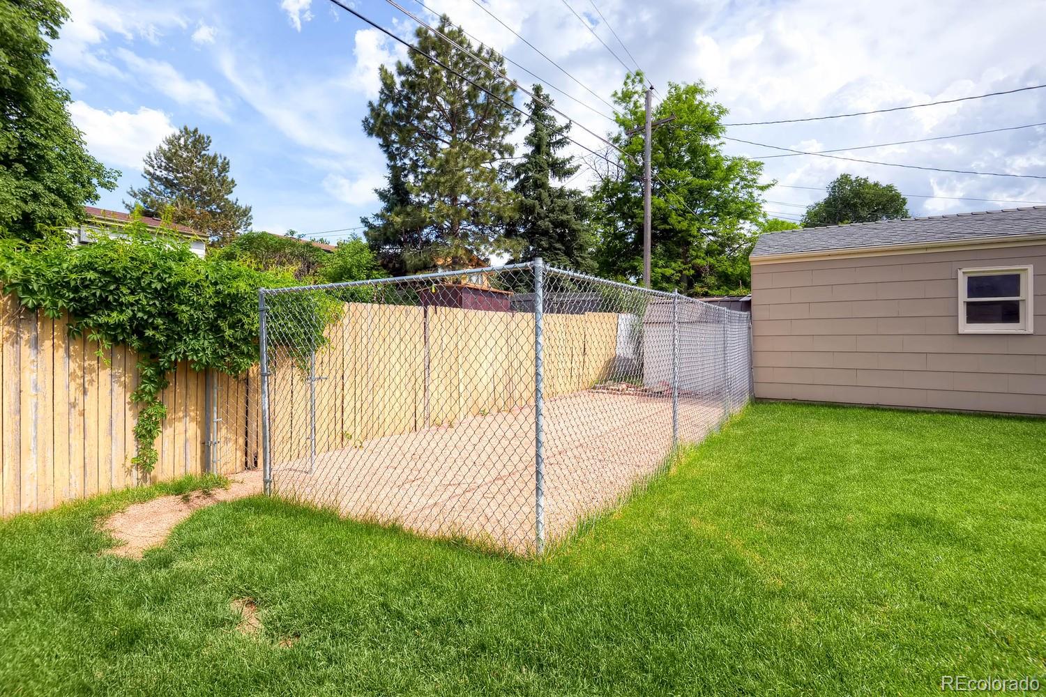 1760 South Java Way Denver, CO 80219 - Photo 27 of 28 a view of a backyard with a garden