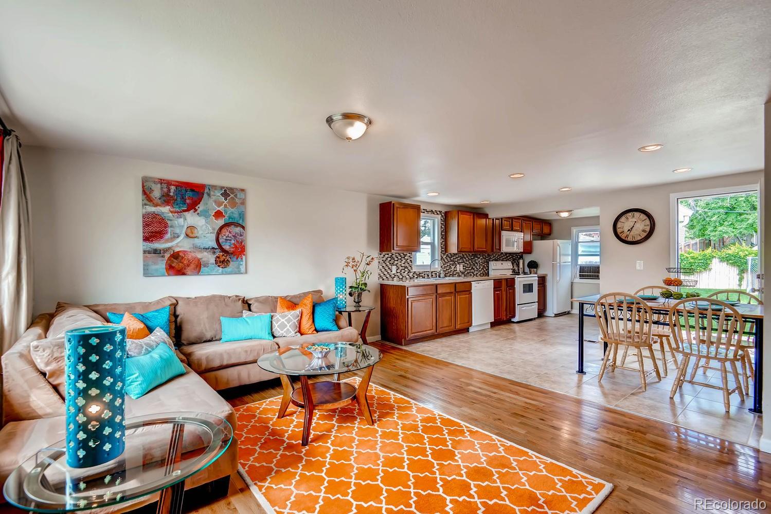 1760 South Java Way Denver, CO 80219 - Photo 3 of 28 a living room with furniture and wooden floor