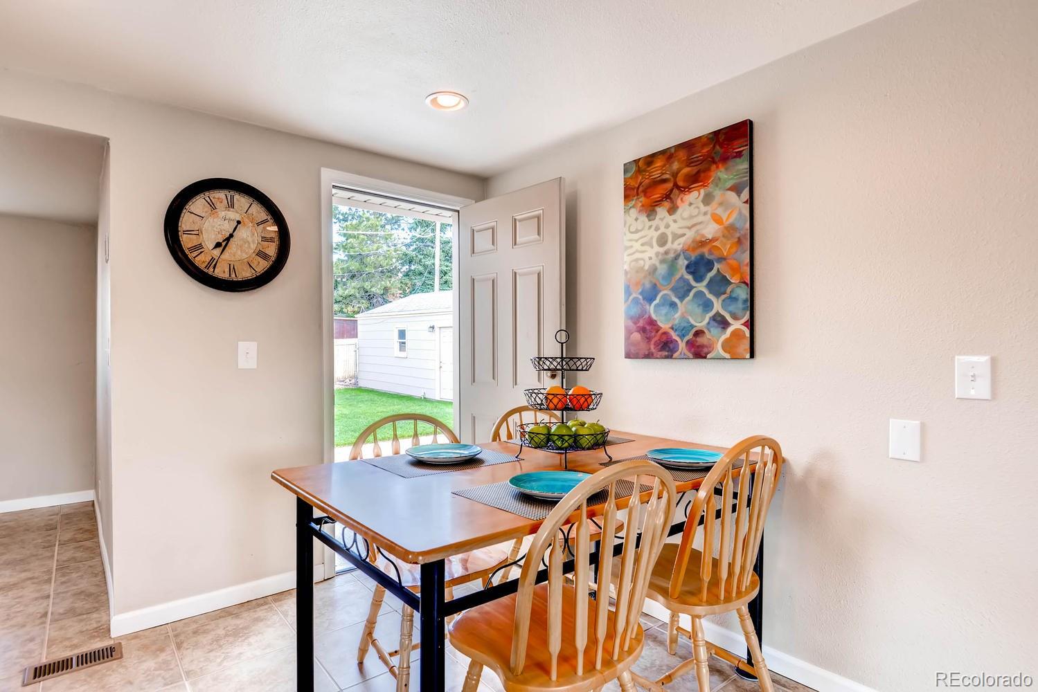 1760 South Java Way Denver, CO 80219 - Photo 6 of 28 a view of a dining room with furniture and a table