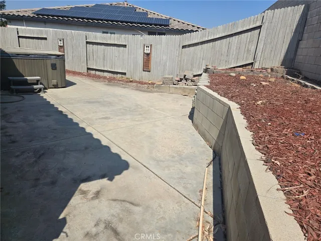 a view of a storage room with wooden fence