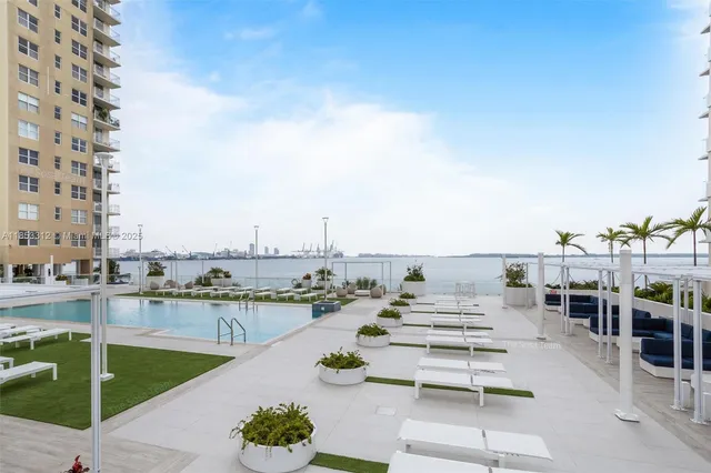 a view of a swimming pool and a chairs