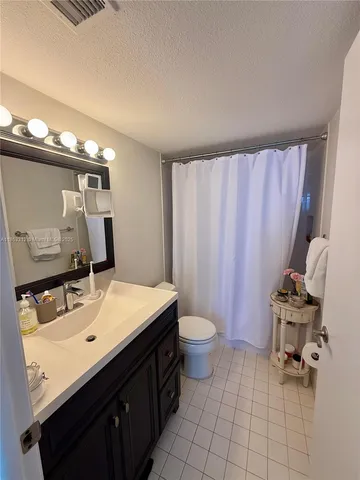 a bed room with a bed and a window