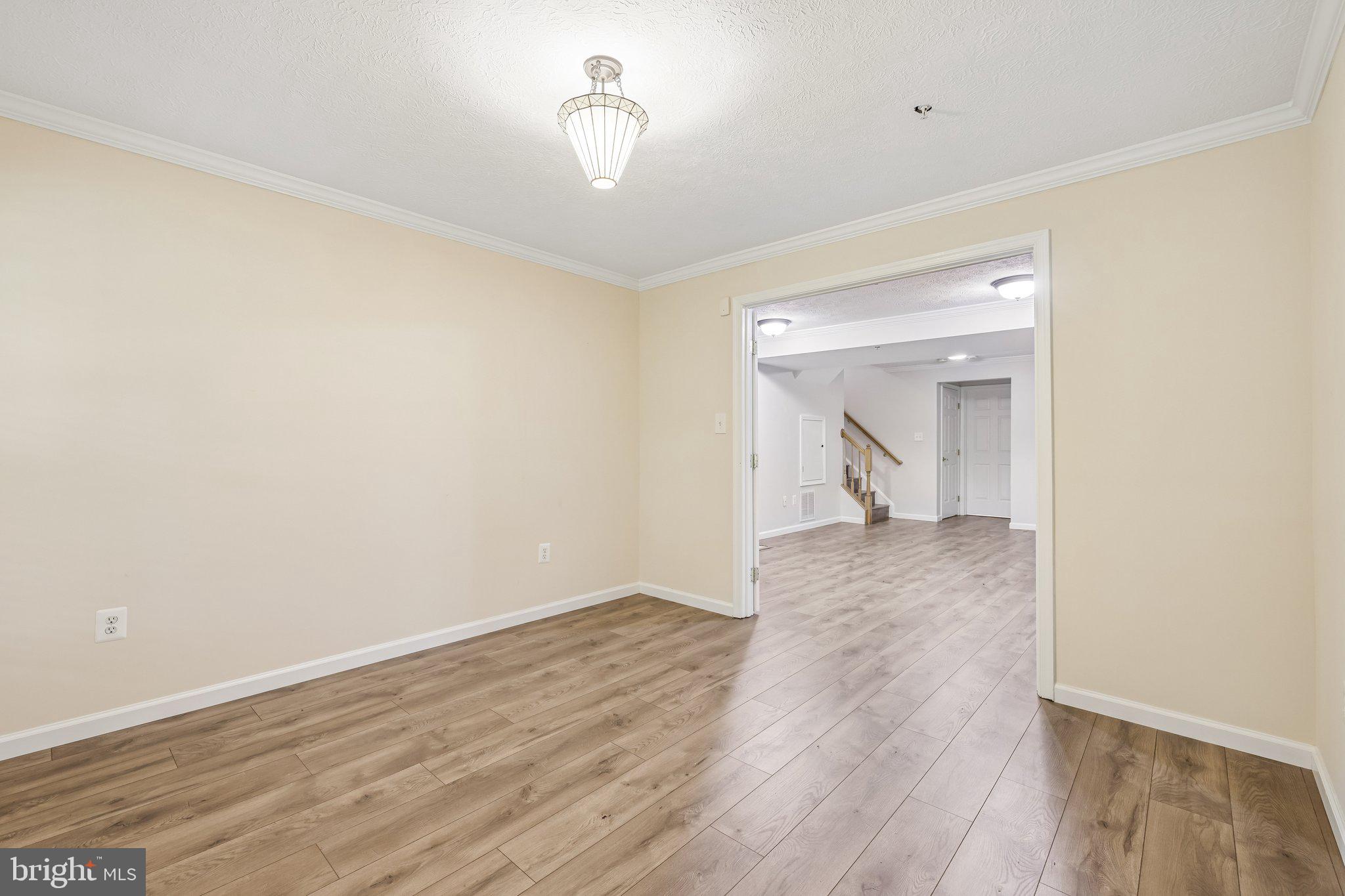 8727 Thornbrook Drive Odenton, MD 21113 - Photo 16 of 40 a view of empty room with wooden floor