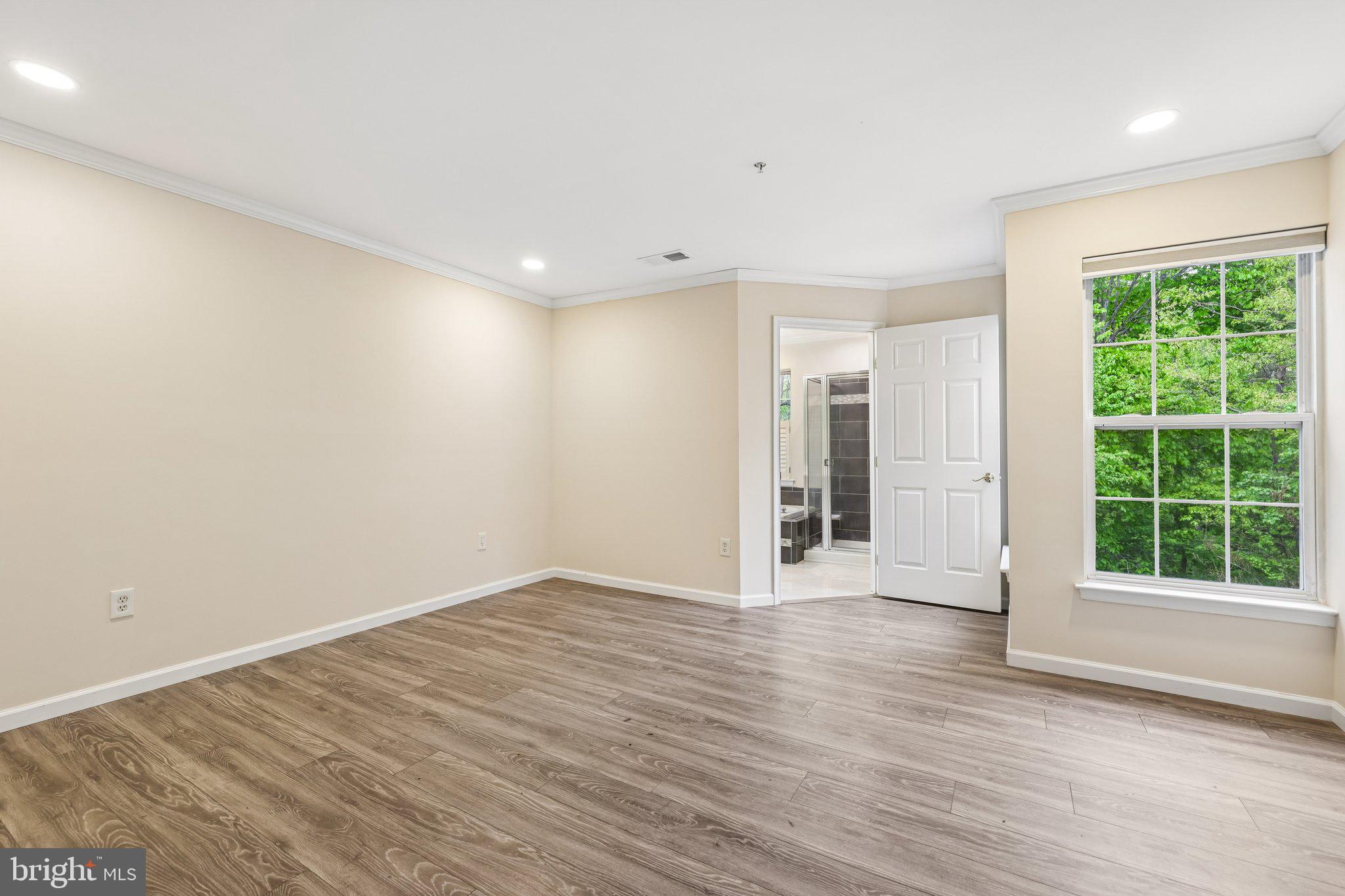 8727 Thornbrook Drive Odenton, MD 21113 - Photo 17 of 40 wooden floor in an empty room with a window