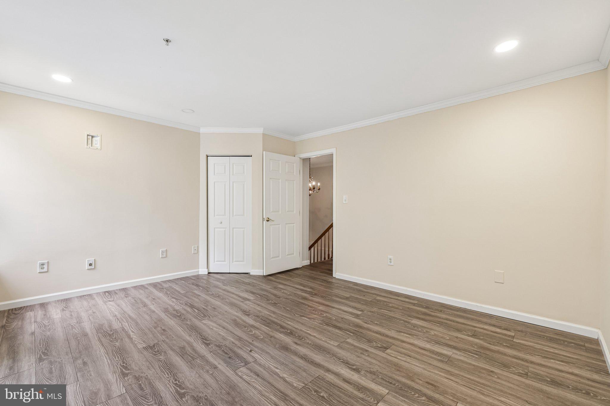 8727 Thornbrook Drive Odenton, MD 21113 - Photo 18 of 40 a view of an empty room with wooden floor