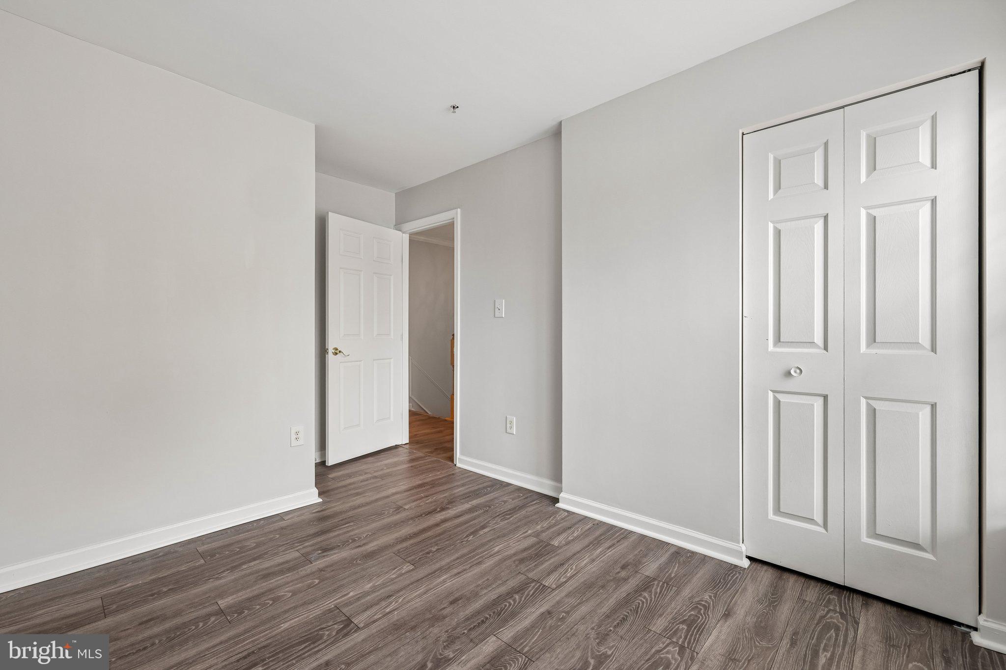 8727 Thornbrook Drive Odenton, MD 21113 - Photo 19 of 40 an empty room with wooden floor