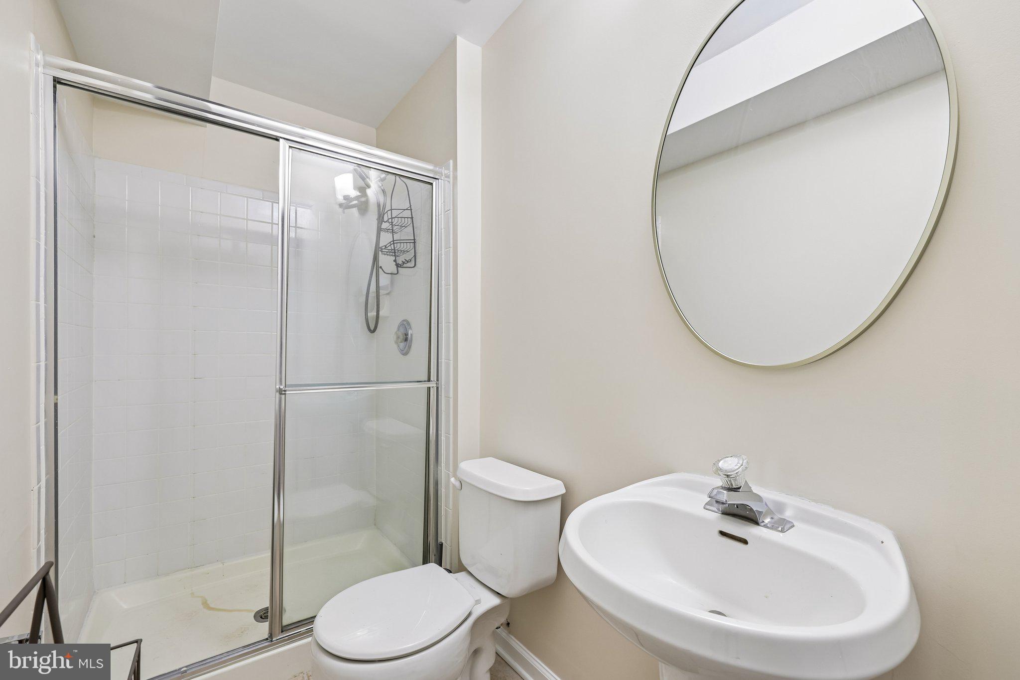 8727 Thornbrook Drive Odenton, MD 21113 - Photo 24 of 40 a bathroom with a sink toilet and a mirror