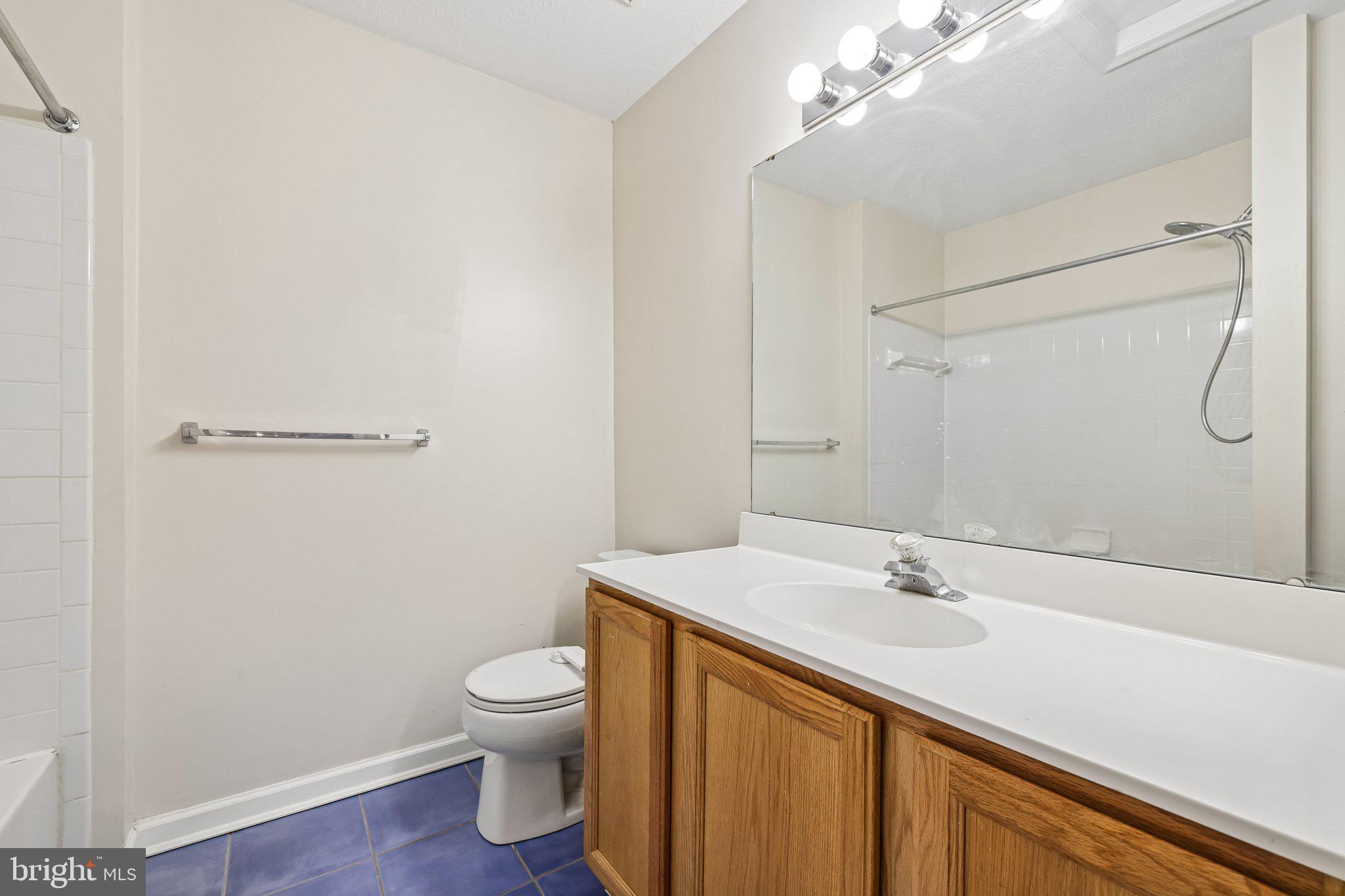 8727 Thornbrook Drive Odenton, MD 21113 - Photo 27 of 40 a bathroom with a sink a toilet and shower