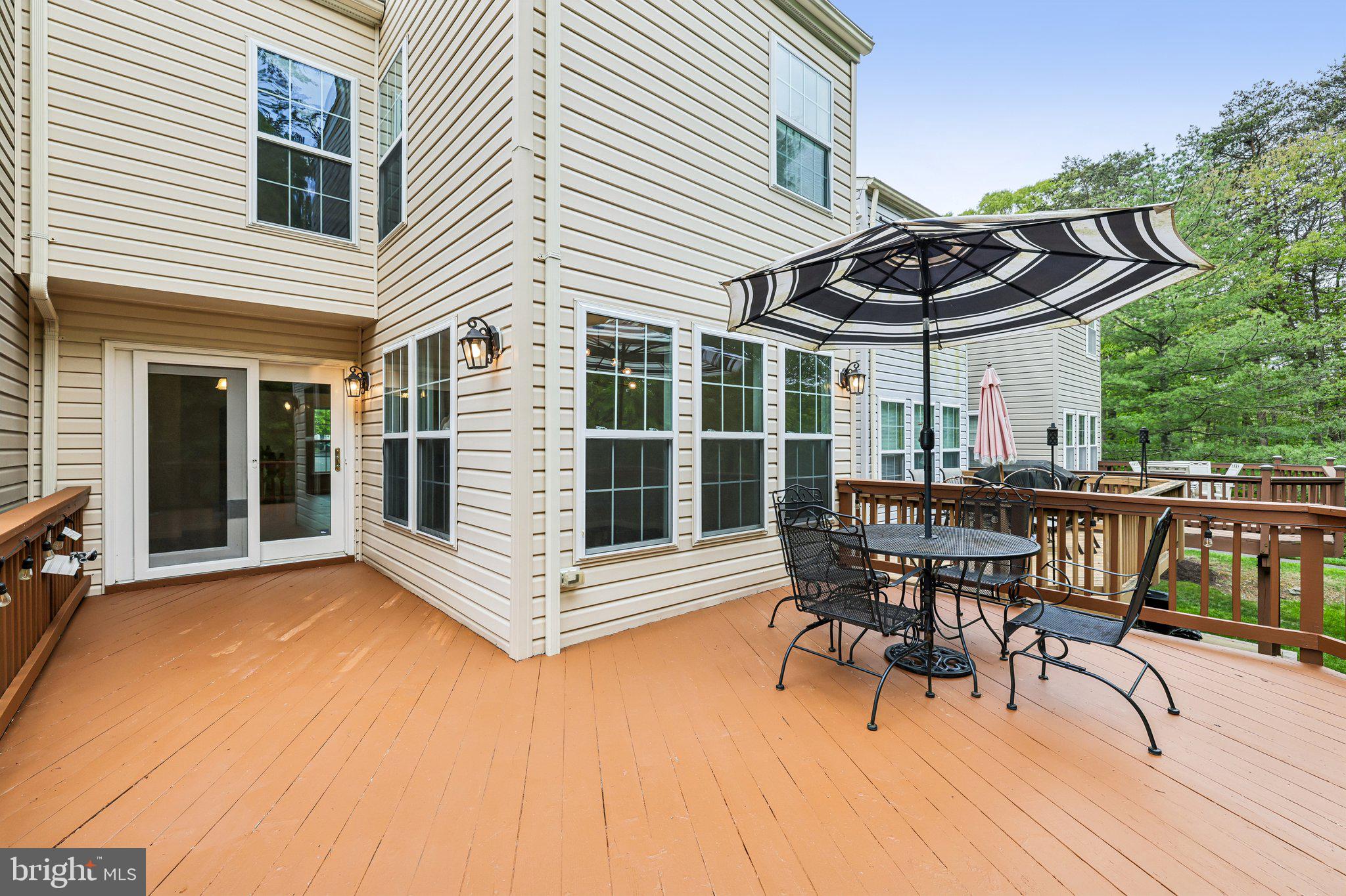8727 Thornbrook Drive Odenton, MD 21113 - Photo 33 of 40 a view of house with deck and outdoor seating