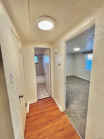 a view of a bedroom from the hallway