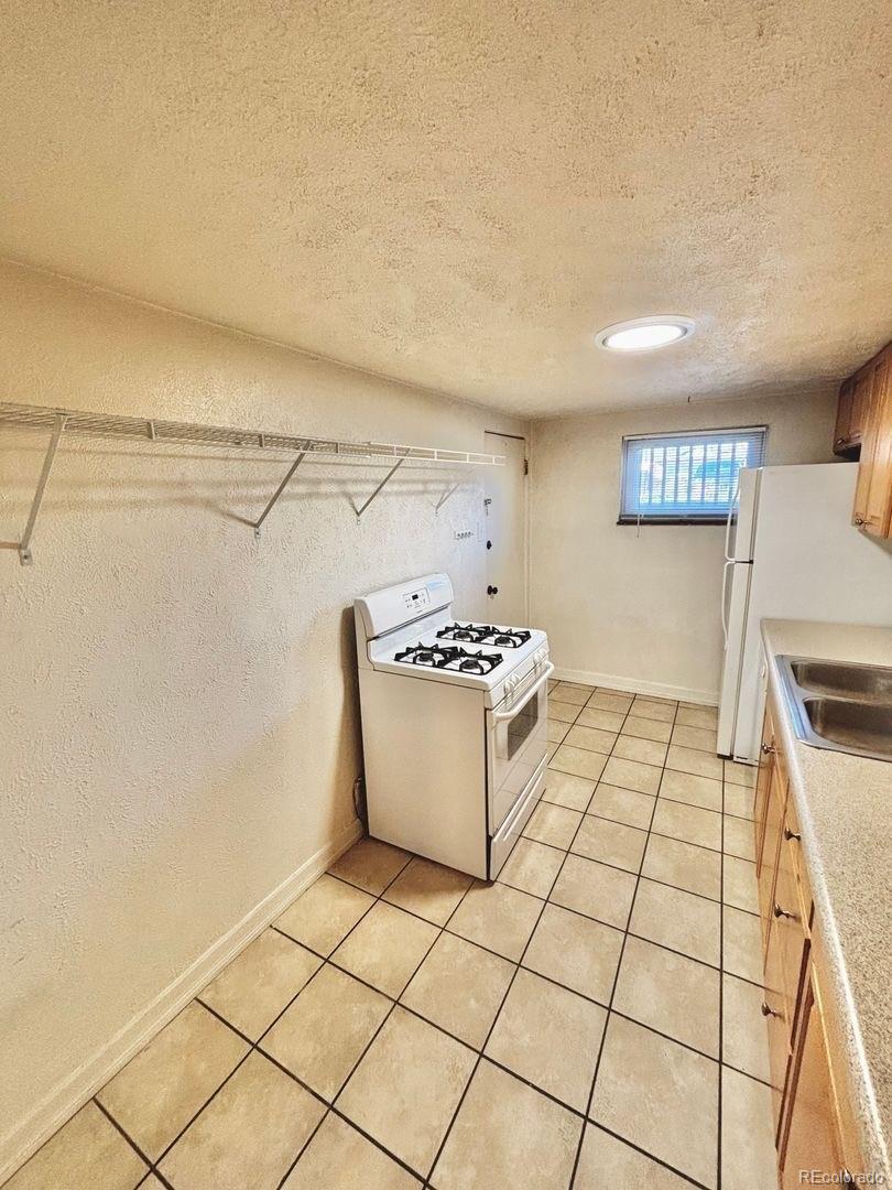 3475 Ames Street, Unit C Wheat Ridge, CO 80212 - Photo 10 of 17 a view of a kitchen storage and utility
