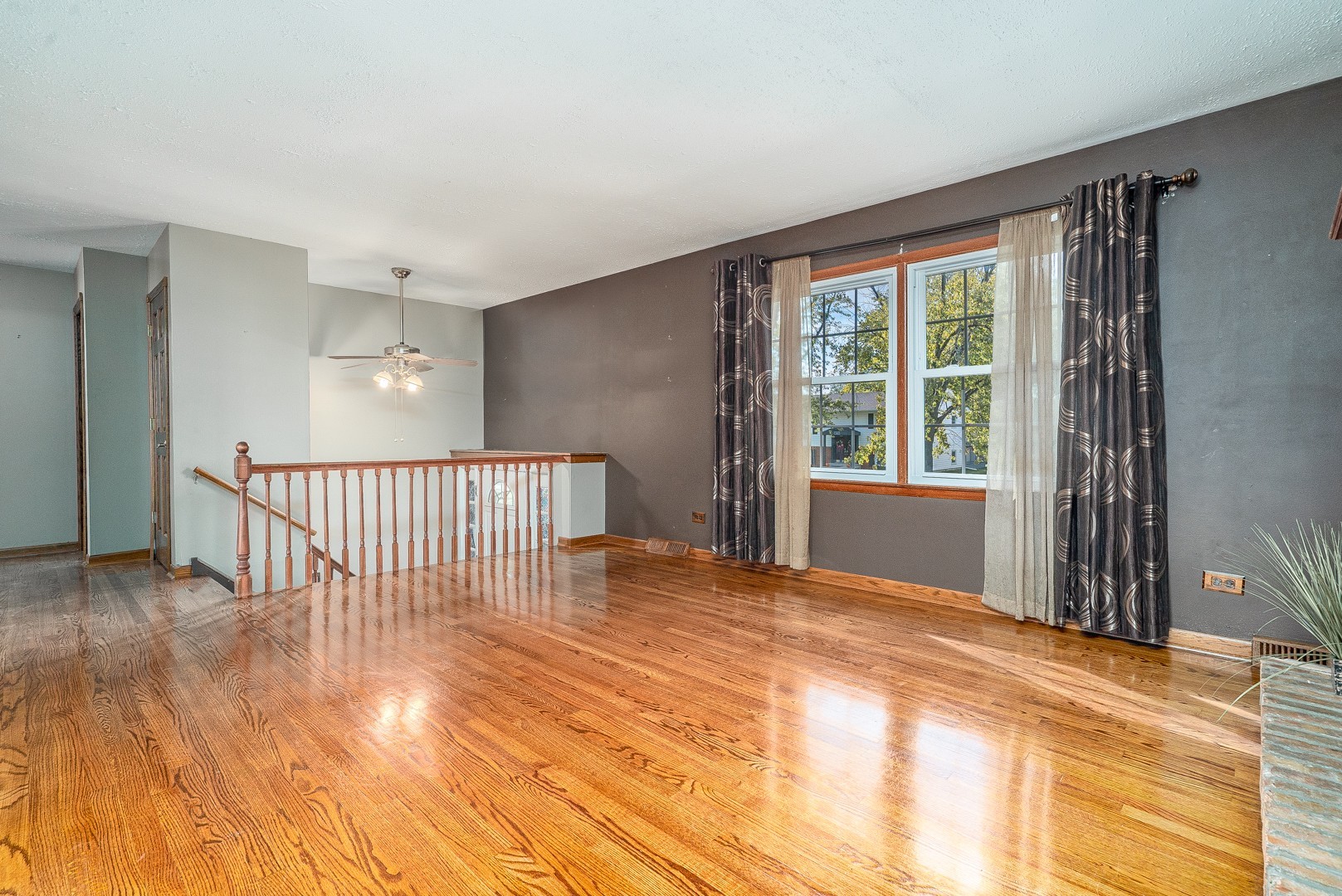 1425 Douglas Lane Crete, IL 60417 - Photo 2 of 19 a view of an empty room with wooden floor and a window